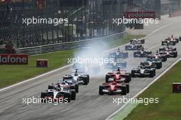 10.09.2006 Monza, Italy,  Start of the race - Kimi Raikkonen (FIN), Räikkönen, McLaren Mercedes, Nick Heidfeld (GER), BMW Sauber F1 Team, Michael Schumacher (GER), Scuderia Ferrari - Formula 1 World Championship, Rd 15, Italian Grand Prix, Saturday Qualifying