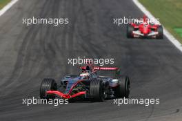 10.09.2006 Monza, Italy,  Kimi Raikkonen (FIN), Räikkönen, McLaren Mercedes, MP4-21 and Michael Schumacher (GER), Scuderia Ferrari, 248 F1 - Formula 1 World Championship, Rd 15, Italian Grand Prix, Sunday Race