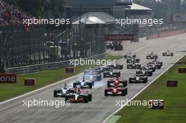 10.09.2006 Monza, Italy,  Start of the race - Kimi Raikkonen (FIN), Räikkönen, McLaren Mercedes, Nick Heidfeld (GER), BMW Sauber F1 Team, Michael Schumacher (GER), Scuderia Ferrari - Formula 1 World Championship, Rd 15, Italian Grand Prix, Saturday Qualifying