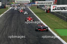 10.09.2006 Monza, Italy,  Kimi Raikkonen (FIN), Räikkönen, McLaren Mercedes, MP4-21 and Michael Schumacher (GER), Scuderia Ferrari, 248 F1 - Formula 1 World Championship, Rd 15, Italian Grand Prix, Sunday Race