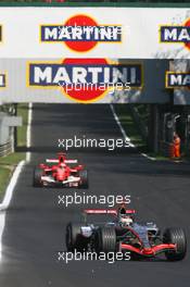 10.09.2006 Monza, Italy,  Kimi Raikkonen (FIN), Räikkönen, McLaren Mercedes, MP4-21 and Michael Schumacher (GER), Scuderia Ferrari, 248 F1 - Formula 1 World Championship, Rd 15, Italian Grand Prix, Sunday Race