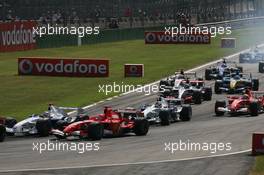 10.09.2006 Monza, Italy,  Start of the race - Michael Schumacher (GER), Scuderia Ferrari, Nick Heidfeld (GER), BMW Sauber F1 Team - Formula 1 World Championship, Rd 15, Italian Grand Prix, Saturday Qualifying