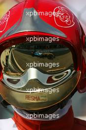 09.09.2006 Monza, Italy,  Fernando Alonso (ESP), Renault F1 Team, R26, reflection in fire marshals helmet - Formula 1 World Championship, Rd 15, Italian Grand Prix, Saturday Practice