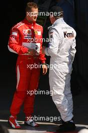 09.09.2006 Monza, Italy,  Michael Schumacher (GER), Scuderia Ferrari, 248 F1 and Kimi Raikkonen (FIN), Räikkönen, McLaren Mercedes, MP4-21 - Formula 1 World Championship, Rd 15, Italian Grand Prix, Saturday Qualifying