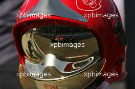 09.09.2006 Monza, Italy,  Scott Speed (USA), Scuderia Toro Rosso, STR01, reflection in fire marshals helmet - Formula 1 World Championship, Rd 15, Italian Grand Prix, Saturday Practice
