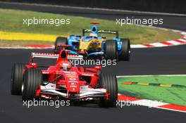 09.09.2006 Monza, Italy,  Michael Schumacher (GER), Scuderia Ferrari, 248 F1 and Fernando Alonso (ESP), Renault F1 Team, R26 - Formula 1 World Championship, Rd 15, Italian Grand Prix, Saturday Qualifying