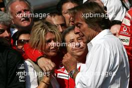 10.09.2006 Monza, Italy,  Luca di Montezemolo (ITA), Scuderia Ferrari, Fiat President, Chairman & Managing Director, in the back Corina Schumacher (GER), Corinna, Wife of Michael Schumacher and Jean Todt (FRA), Scuderia Ferrari, Teamchief, General Manager, Team Principal - Formula 1 World Championship, Rd 15, Italian Grand Prix, Sunday