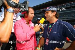 10.09.2006 Monza, Italy,  Alessandro Zanardi (ITA) speaks to RTL TV on the grid - Formula 1 World Championship, Rd 15, Italian Grand Prix, Sunday