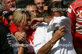 10.09.2006 Monza, Italy,  Luca di Montezemolo (ITA), Scuderia Ferrari, Fiat President, Chairman & Managing Director, in the back Corina Schumacher (GER), Corinna, Wife of Michael Schumacher and Jean Todt (FRA), Scuderia Ferrari, Teamchief, General Manager, Team Principal - Formula 1 World Championship, Rd 15, Italian Grand Prix, Sunday