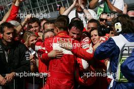 10.09.2006 Monza, Italy,  Michael Schumacher (GER), Scuderia Ferrari, in the backgr. Corina Schumacher (GER), Corinna, Wife of Michael Schumacher and Jean Todt (FRA), Scuderia Ferrari, Teamchief, General Manager, Team Principal - Formula 1 World Championship, Rd 15, Italian Grand Prix, Sunday