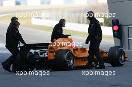 13.01.2006 Jerez, Spain,  Gary Paffett (GBR), Test Driver, in an interim Orange McLaren Mercedes, been pushed back into the pit - Formula One Testing