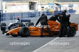 13.01.2006 Jerez, Spain,  Pedro de la Rosa (ESP), Test Driver, McLaren Mercedes, in an interim Orange McLaren Mercedes been pushed bacvk into the pit - Formula One Testing