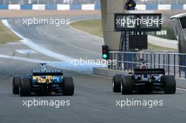 10.01.2006 Jerez, Spain,  David Coulthard (GBR), Red Bull Racing, driving the new RB2, and Fernando Alonso (ESP), Renault F1 Team in the old R25 - Formula One Testing