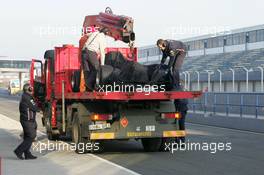 10.01.2006 Jerez, Spain,  David Coulthard (GBR), Red Bull Racing, the new RB2 is taken back to the pits after the RB2 stopped on circuit  - Formula One Testing