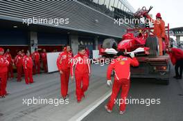 10.01.2006 Jerez, Spain,  Michael Schumacher (GER), Scuderia Ferrari, car is taken back to the pits after stopped in the gravel - Formula One Testing