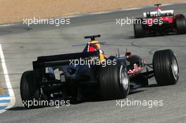 11.01.2006 Jerez, Spain,  David Coulthard (GBR), Red Bull Racing, in the new RB2 behind Luca Badoer (ITA), Test Driver, Scuderia Ferrari - Formula One Testing