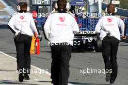 07.02.2006 Jerez, Spain,  Rubens Barrichello (BRA), Honda Racing F1 Team, stops in the pitlane and the mechanics run to the car