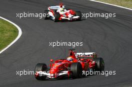 08.10.2006 Suzuka, Japan,  Felipe Massa (BRA), Scuderia Ferrari, 248 F1 and Ralf Schumacher (GER), Toyota Racing, TF106 - Formula 1 World Championship, Rd 17, Japanese Grand Prix, Sunday Race