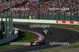 08.10.2006 Suzuka, Japan,  Jarno Trulli (ITA), Toyota Racing, TF106 leads Ralf Schumacher (GER), Toyota Racing, TF106 - Formula 1 World Championship, Rd 17, Japanese Grand Prix, Sunday Race