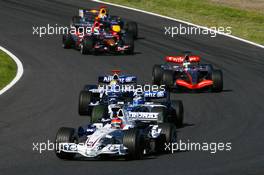 08.10.2006 Suzuka, Japan,  Robert Kubica (POL), BMW Sauber F1 Team, F1.06 and Nico Rosberg (GER), WilliamsF1 Team, FW28 Cosworth - Formula 1 World Championship, Rd 17, Japanese Grand Prix, Sunday Race