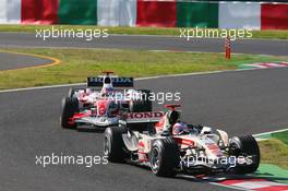 08.10.2006 Suzuka, Japan,  Rubens Barrichello (BRA), Honda Racing F1 Team, RA106  and Takuma Sato (JPN), Super Aguri F1, SA06 - Formula 1 World Championship, Rd 17, Japanese Grand Prix, Sunday Race