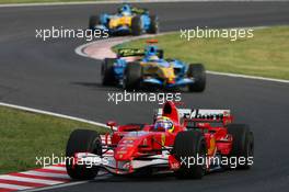 07.10.2006 Suzuka, Japan,  Felipe Massa (BRA), Scuderia Ferrari, 248 F1 and Fernando Alonso (ESP), Renault F1 Team, R26 - Formula 1 World Championship, Rd 17, Japanese Grand Prix, Saturday Qualifying