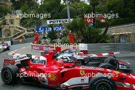 28.05.2006 Monte Carlo, Monaco,  Michael Schumacher (GER), Scuderia Ferrari overtakes Kimi Raikkonen (FIN), Räikkönen, McLaren Mercedes - Formula 1 World Championship, Rd 7, Monaco Grand Prix, Sunday Race