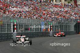 28.05.2006 Monte Carlo, Monaco,  Jenson Button (GBR), Honda Racing F1 Team, RA106 leads Michael Schumacher (GER), Scuderia Ferrari, 248 F1 - Formula 1 World Championship, Rd 7, Monaco Grand Prix, Sunday Race