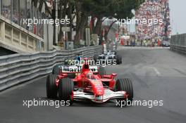 28.05.2006 Monte Carlo, Monaco,  Michael Schumacher (GER), Scuderia Ferrari, 248 F1 leads Giancarlo Fisichella (ITA), Renault F1 Team, R26 - Formula 1 World Championship, Rd 7, Monaco Grand Prix, Sunday Race