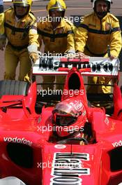 27.05.2006 Monte Carlo, Monaco,  Michael Schumacher (GER), Scuderia Ferrari gets pushed in the Park Ferme - Formula 1 World Championship, Rd 7, Monaco Grand Prix, Saturday Qualifying