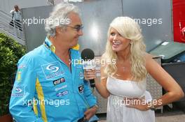 27.05.2006 Monte Carlo, Monaco,  Flavio Briatore (ITA), Renault F1 Team, Team Chief, Managing Director is interviewed by Carolina Gynning (SWE) - Formula 1 World Championship, Rd 7, Monaco Grand Prix, Saturday