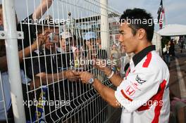 27.05.2006 Monte Carlo, Monaco,  Takuma Sato (JPN) signs autographs for fans, Super Aguri F1 - Formula 1 World Championship, Rd 7, Monaco Grand Prix, Saturday