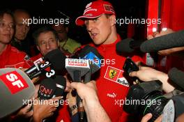 27.05.2006 Monte Carlo, Monaco,  Michael Schumacher (GER), Scuderia Ferrari, giving a press announcement at 9.42pm - Formula 1 World Championship, Rd 7, Monaco Grand Prix, Saturday