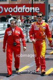 25.05.2006 Monte Carlo, Monaco,  Michael Schumacher (GER), Scuderia Ferrari wearing new overalls for the Monaco GP and Jean Todt (FRA), Scuderia Ferrari, Teamchief, General Manager, Team Principal - Formula 1 World Championship, Rd 7, Monaco Grand Prix, Thursday