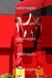 24.05.2006 Monte Carlo, Monaco,  A Scuderia Ferrari team member cleans the trucks - Formula 1 World Championship, Rd 7, Monaco Grand Prix, Wednesday