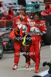 19.03.2006 Kuala Lumpur, Malaysia,  Michael Schumacher (GER), Scuderia Ferrari and Felipe Massa (BRA), Scuderia Ferrari - Formula 1 World Championship, Rd 2, Malaysian Grand Prix, Sunday Podium