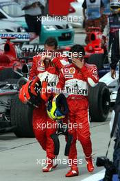 19.03.2006 Kuala Lumpur, Malaysia,  Michael Schumacher (GER), Scuderia Ferrari and Felipe Massa (BRA), Scuderia Ferrari - Formula 1 World Championship, Rd 2, Malaysian Grand Prix, Sunday Podium