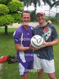 15.03.2006 Kuala Lumpur, Malaysia,  Michael Schumacher (GER), Scuderia Ferrari and Ralf Schumacher (GER), Toyota Racing during a private football game Wednesday evening - Formula 1 World Championship, Rd 2, Malaysian Grand Prix, Thursday