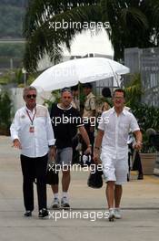 16.03.2006 Kuala Lumpur, Malaysia,  Willi Weber (GER), Driver Manager and Michael Schumacher (GER), Scuderia Ferrari - Formula 1 World Championship, Rd 2, Malaysian Grand Prix, Thursday