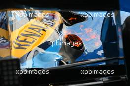 26.04.2006 Silverstone, England, Fire comes out of the exhaust of Fernando Alonso (ESP), Renault F1 Team as he returns to the pits