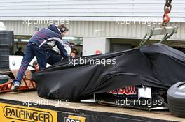 26.04.2006 Silverstone, England, The Red Bull Racing Car of Vitantonio Liuzzi (ITA), test driver, is returned to the pits after a crash