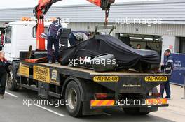 26.04.2006 Silverstone, England, The Red Bull Racing Car of Vitantonio Liuzzi (ITA), test driver, is returned to the pits after a crash
