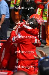 23.04.2006 Imola, Italy,  Michael Schumacher (GER), Scuderia Ferrari hugs Jean Todt (FRA), Scuderia Ferrari, Teamchief, General Manager, Team Principal - Formula 1 World Championship, Rd 4, San Marino Grand Prix, Sunday Podium