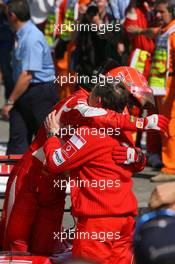 23.04.2006 Imola, Italy,  Michael Schumacher (GER), Scuderia Ferrari hugs Jean Todt (FRA), Scuderia Ferrari, Teamchief, General Manager, Team Principal - Formula 1 World Championship, Rd 4, San Marino Grand Prix, Sunday Podium