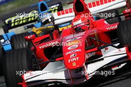 23.04.2006 Imola, Italy,  Michael Schumacher (GER), Scuderia Ferrari, 248 F1 leads Fernando Alonso (ESP), Renault F1 Team, R26 - Formula 1 World Championship, Rd 4, San Marino Grand Prix, Sunday Race