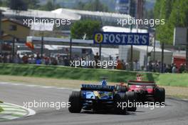 23.04.2006 Imola, Italy,  Fernando Alonso (ESP), Renault F1 Team, R26 follows Michael Schumacher (GER), Scuderia Ferrari, 248 F1 - Formula 1 World Championship, Rd 4, San Marino Grand Prix, Sunday Race