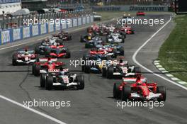 23.04.2006 Imola, Italy,  Michael Schumacher (GER), Scuderia Ferrari, 248 F1 leads the start of the race - Formula 1 World Championship, Rd 4, San Marino Grand Prix, Sunday Race