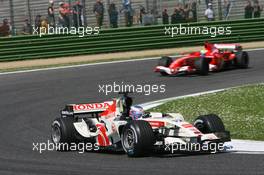 23.04.2006 Imola, Italy,  Jenson Button (GBR), Honda Racing F1 Team, RA106 leads Felipe Massa (BRA), Scuderia Ferrari, 248 F1 - Formula 1 World Championship, Rd 4, San Marino Grand Prix, Sunday Race