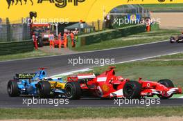 23.04.2006 Imola, Italy,  Michael Schumacher (GER), Scuderia Ferrari, 248 F1 leads Fernando Alonso (ESP), Renault F1 Team, R26 - Formula 1 World Championship, Rd 4, San Marino Grand Prix, Sunday Race