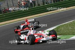 23.04.2006 Imola, Italy,  Takuma Sato (JPN), Super Aguri F1, SA05 leads Tiago Monteiro (PRT), Midland MF1 Racing, Toyota M16 - Formula 1 World Championship, Rd 4, San Marino Grand Prix, Sunday Race